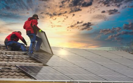 crew installing solar panels while the sun is rising
